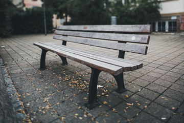 Empty Old Wooden Bench in the Park Shooted with Tilt and Shift Lens