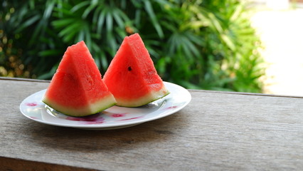 Closeup watermelon on wooden table with nature background