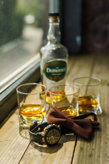 details of the groom, watches a bow tie, shoes and whiskey