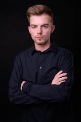 Portrait of young handsome blond bearded businessman