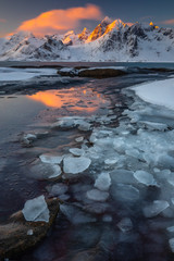 Soft tones of the golden hour in mountains at the coast of Vareid, Lofoten, Norway
