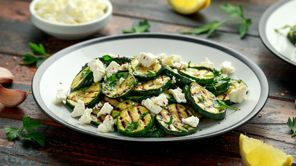 Warm salad with grilled zucchini, garlic and herbs