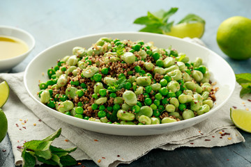 Green Broad beans and quinoa salad with sweet peas and mint. Healthy vegan food