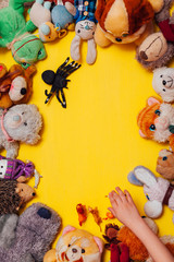 Fototapeta na wymiar children's toys for development and games boys and girls yellow background