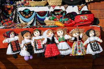 Group of colourful textile hand made decorations, dolls and  toys for children, available for sale...