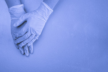 women's hands in medical latex gloves