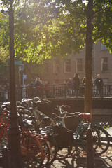 Fototapeta na wymiar View of a bridge and bikes in Amsterdam on a sunny day