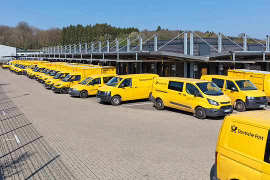 N&Uuml;MBRECHT, GERMANY - April 12, 2020: Deutsche Post delivery vans at depot. Deutsche Post is a brand of Deutsche Post AG used for its domestic mail services in Germany.