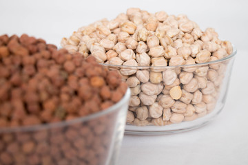 Group of white chickpeas or white chana in a bowl on a white background 