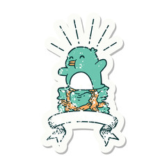 grunge sticker of tattoo style penguin sitting on present