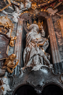 St Jerome Hieronymus statue  in entrance hall to Baroque church Asamkirche in Munich, Germany