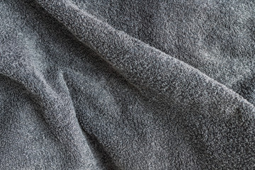 Grey background texture of Terry towel fabric, wavy folds - obrazy, fototapety, plakaty