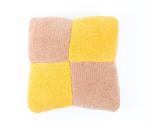 Colorful knitted pillow on the white