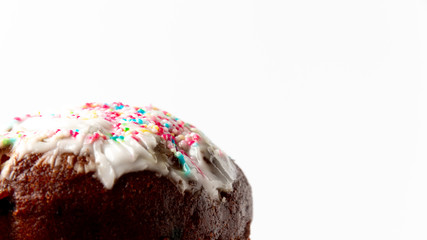 Fragment of a decorated cake on a white background. Easter cake kulich
