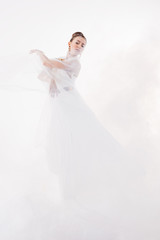 Fototapeta na wymiar Ballerina jump in the clouds