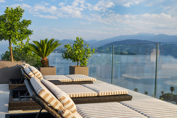 Sun loungers overlooking Lake Maggiore in Italy