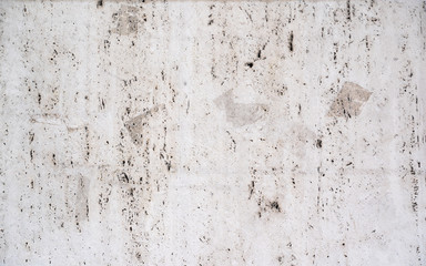 old concrete background wall damaged with holes and stains
