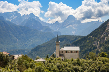 Church on a hill in the mountains, Italy