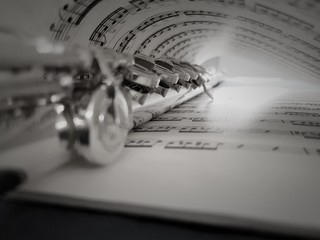 Close-up Of Sheet Music With Musical Equipment