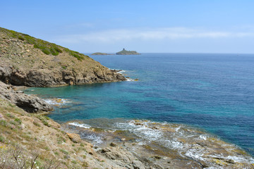 Sentier des Douaniers, a coastal path on the Cap Corse, with view of Plage des Iles, the beach of the islands of the nature reserve of Finocchiarola. France