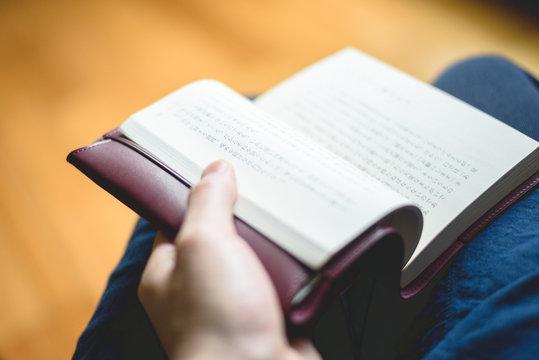 I am reading a Japanese novel with a leather jacket.