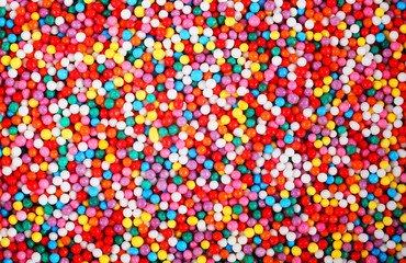 Fototapeta na wymiar small colorful balls, background, texture