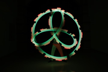 neon pixel freeze light glowing atom symbol on dark background