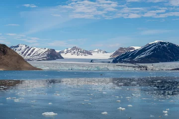Fototapeten Blau Arctic landscape with mountain and glacier in Svalbard in summer time  © Alexey Seafarer