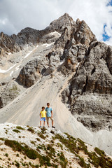 Fototapeta premium Two boys walk in mountains, Italy
