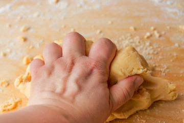Hand kneading dough.