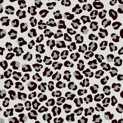 Leopard seamless pattern. Vector animal print. Black and grey spots on a white background. Jaguar, leopard, cheetah, panther fur. Leopard skin imitation can be painted on clothes or fabric.