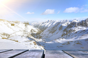 Empty wooden base suitable for mockup. Snow background theme.