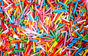 Fototapeta na wymiar small multi-colored sticks, background, texture
