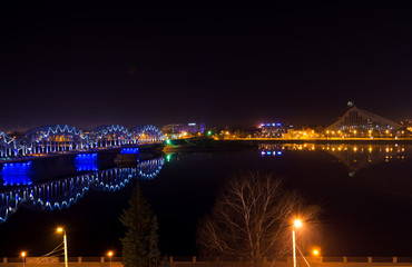 Railway bridge and buildings in Riga at night