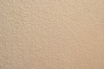 cream cement wall in building background and  texture
