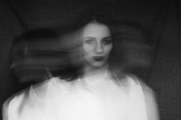 crazy portrait of girl with mental disorders and split personality. Black and white with added...