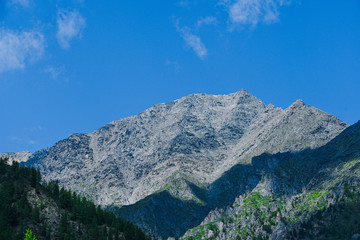 rocky mountains on horizon, valley for hiking and tourism