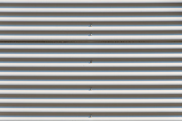 Obraz premium Corrugated iron sheet facade close up shot for use as texture