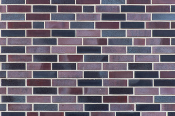 Dutch clinker dark bricks pattern in different tones of dark grey and deep red