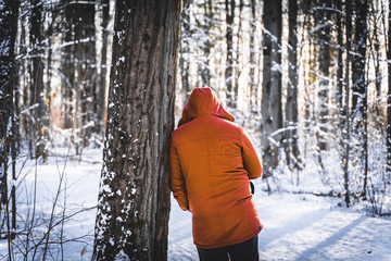 young woman in winter forest