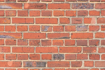 Old red brick dutch clinker facade of industrial building close up pattern