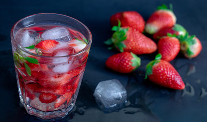 strawberry cocktail with strawberry on a black background