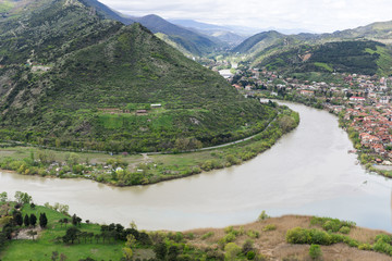view from the river Georgia.  The merging of the Kura and Aragvi. The top view of Mtskheta, Georgia. The historical town lies at the confluence of the rivers. Georgian landscape