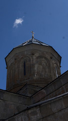 Stepantsminda, Gergeti, Georgia. Famous Gergeti Trinity Tsminda Sameba Church In Early Winter Landscape.