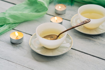 Fototapeta na wymiar Green tea in white ceramic cups