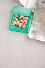 Pillbox with cut pills to take daily dose
