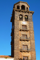 Fototapeta na wymiar Bell and clock tower of the Church of La Concepcion in the city of La Laguna. Tenerife Island. Spain.