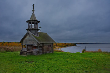 Fototapeta premium Russia. Karelia. Ancient Orthodox Church on the shore of lake Ladoga, built of wood without a single nail