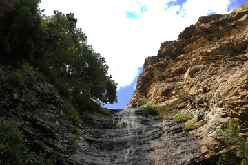 A beautiful landscape of a waterfall in mountains