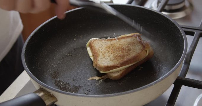 Sandwich on a Frying Pan with Toast Bread and Cheese Shot on Red Camera